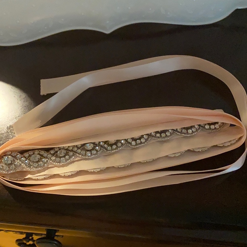 Women’s silk belt in a light peach. Brand new.